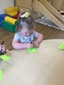 Child at table with paper and pen