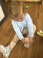 Child putting on a shoe