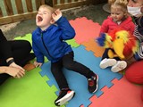 Children on mat listening