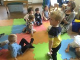 Children on mats on the floor