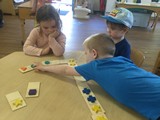 Children playing with large dominoes