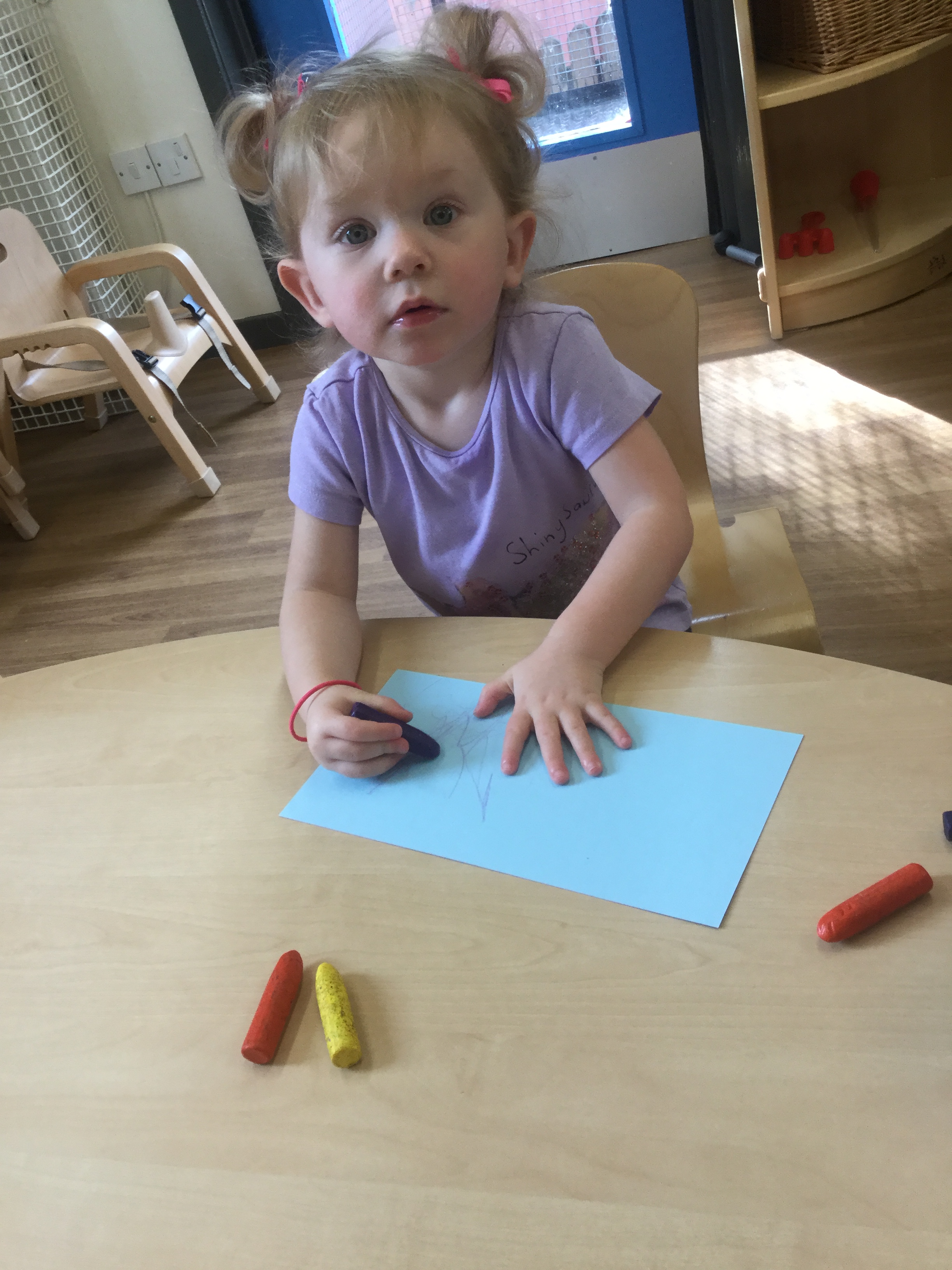 girl at table drawing